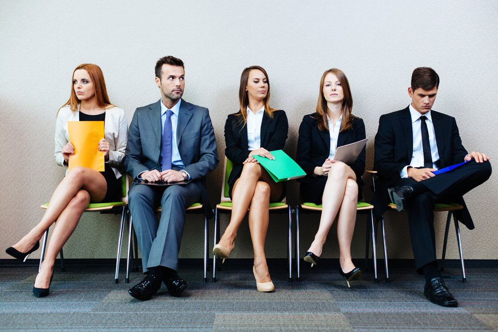 a group of women and men sat in a line